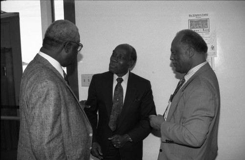 Rev. Cecil "Chip" Murray speaking with two men at Grant A.M.E. Church, Los Angeles, 1997