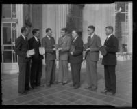 William G. Dickinson, Fred B. Palmer, H. Gordon Moore, B. W. Tye, John A. Ash, and Edward J. Partridge are presented with awards in real estate by Norman Chandler, Los Angeles, 1936