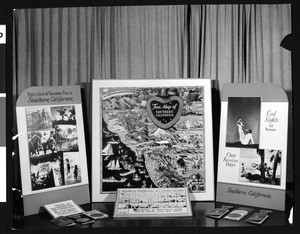 Travel maps showing vacation fun in Southern California displayed in the Los Angeles Area Chamber of Commerce exhibit room, ca.1935