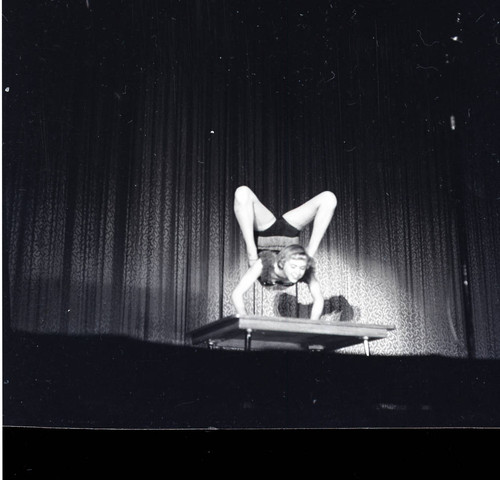 Contortionist performing on stage at or near Fort Ord