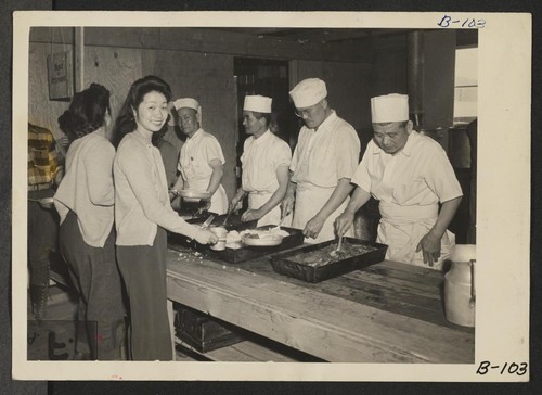 Manzanar, Calif.--Mealtime, cafeteria style, at this War Relocation Authority center. Photographer: Albers, Clem Manzanar, California