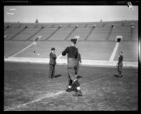 Football player Red Grange and 3 other men, Los Angeles Coliseum, Los Angeles, 1926