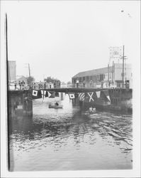 Motor boats going under the Washington Street Bridge, Petaluma, California, about 1974