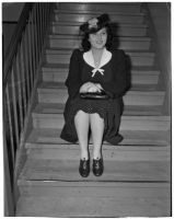 Mrs. Bessie H. Cooper, prominent clubwoman, posing on a staircase, Los Angeles, 1940s