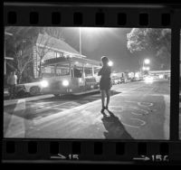 Female USC student waiting for campus trolley, 1968