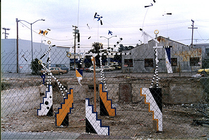 Mobile sculptures in the foundation of a demolished building