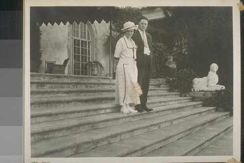 [Man and woman on steps]