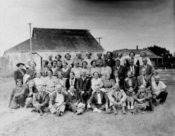 Large group of adults posing for a photo outdoors--possibly the Borba family or Borba family reunion