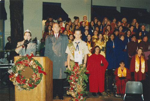 Tree-lighting ceremony with Miss Orange addressing the crowds, Orange, California, 1998