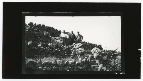 Group portrait of men standing near Mount Helix amphitheater