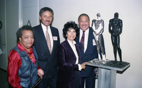 Atkins & Evans guests posing with Nelson L. Atkins and Irwin S. Evans, Los Angeles, 1994