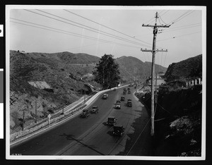 View of Cahuenga Pass looking south near a summit and showing traffic, Hollywood, ca. July 1928