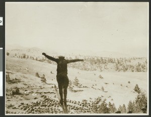 Ski jumper soaring over a snow-covered land, ca.1930