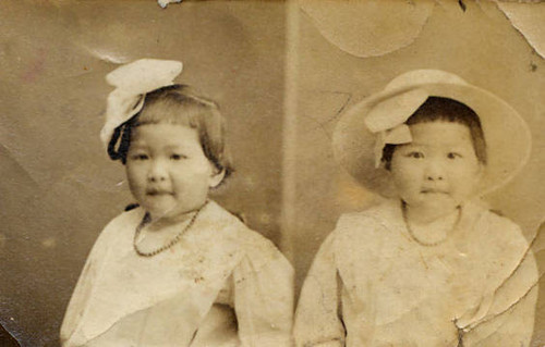 Two young Chinese American girls sitting together