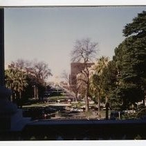 View looking through the window out on to the west side of the California State Capitol grounds. This view shows preparations for the gala to celebrate the completion of the restoration