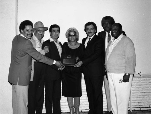 Renaldo Rey, George Kirby and others posing at the Pied Piper Club, Los Angeles, 1984