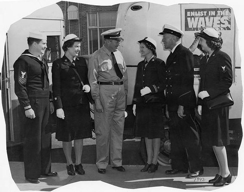 Mayor Leonard Murray (fourth from right) with a group of uniformed servicemen and servicewomen promoting "Enlist in the WAVES", Santa Monica, Calif