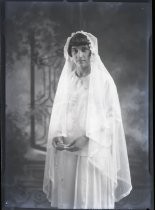 Portrait of young woman in veil, with rosary, c. 1928