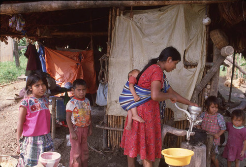 Guatemalan woman with children, Ixcán, ca. 1983