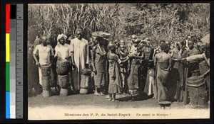 Group preparing for musical performance, Senegal, ca.1920-1940