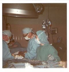 Dr. Horace Sharrocks and Nancy Phillips in hospital surgery at Palm Drive Hospital