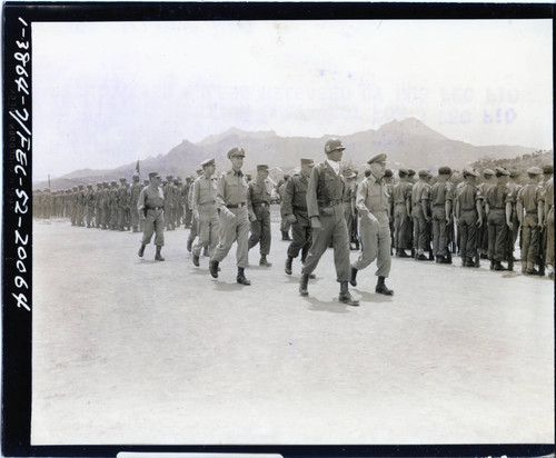 General J. Lawton Collins and party inspecting troops