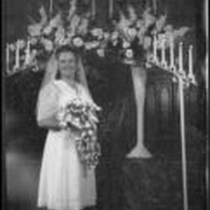 Ann Roth (Mrs. H. H. West, Jr.) poses at the alter on her wedding day ...