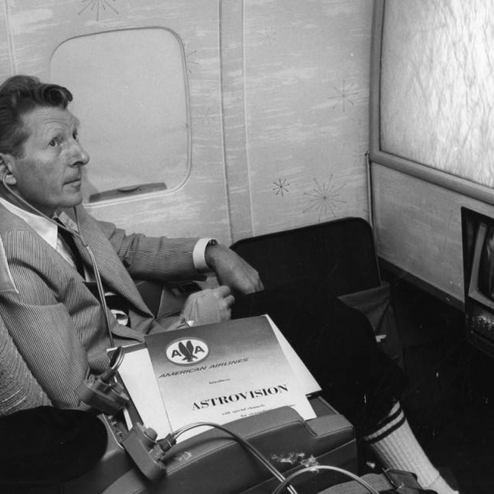 Danny Kaye previewing show on airplane — Calisphere