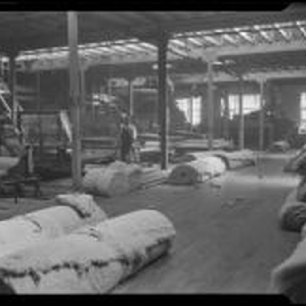 Rolls of batting for upholstery at the Roberti Brothers' furniture factory,  Los Angeles, circa 1920-1930 — Calisphere