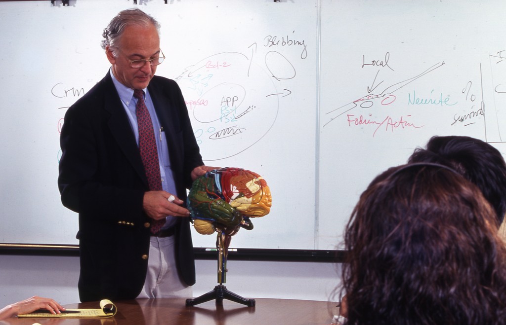 Prof Cooman Professor Carl Cotman, with students. — Calisphere