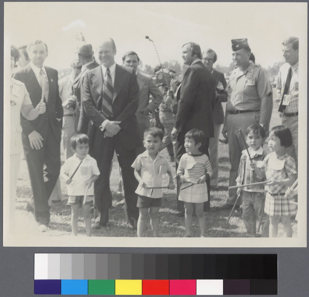 President Gerald Ford standing with children — Calisphere